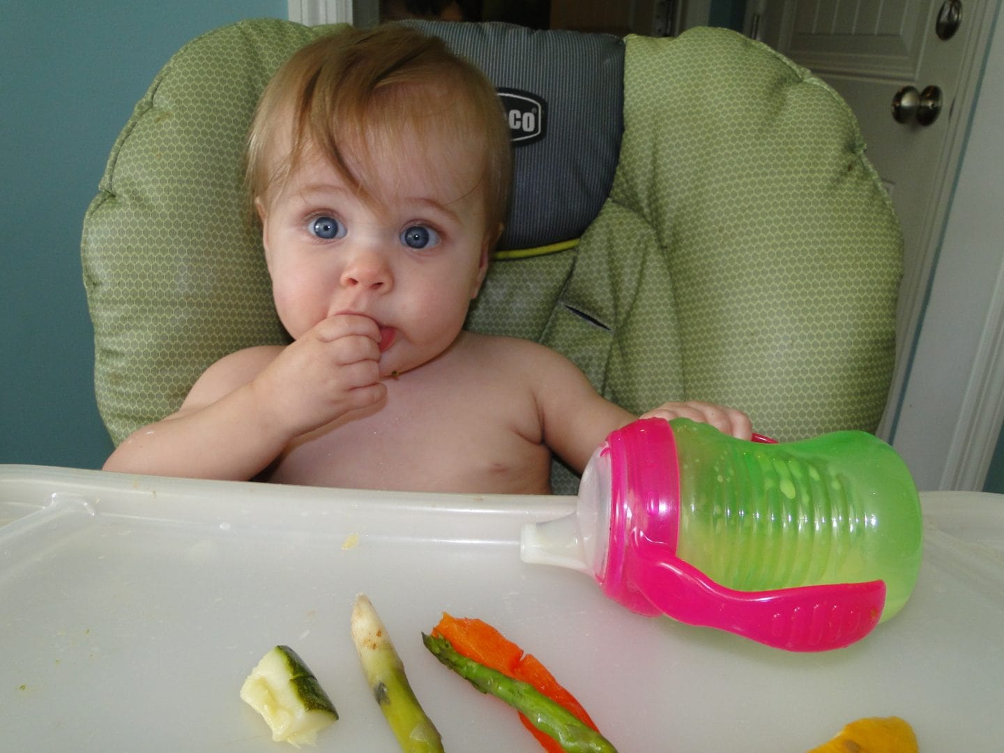 baby eating solid food with baby led weaning