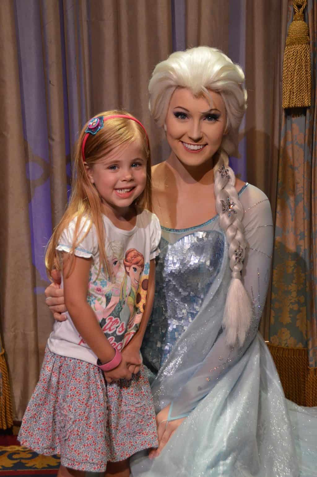 little girl with princess Elsa at Disney World  must see disney movies before first visit