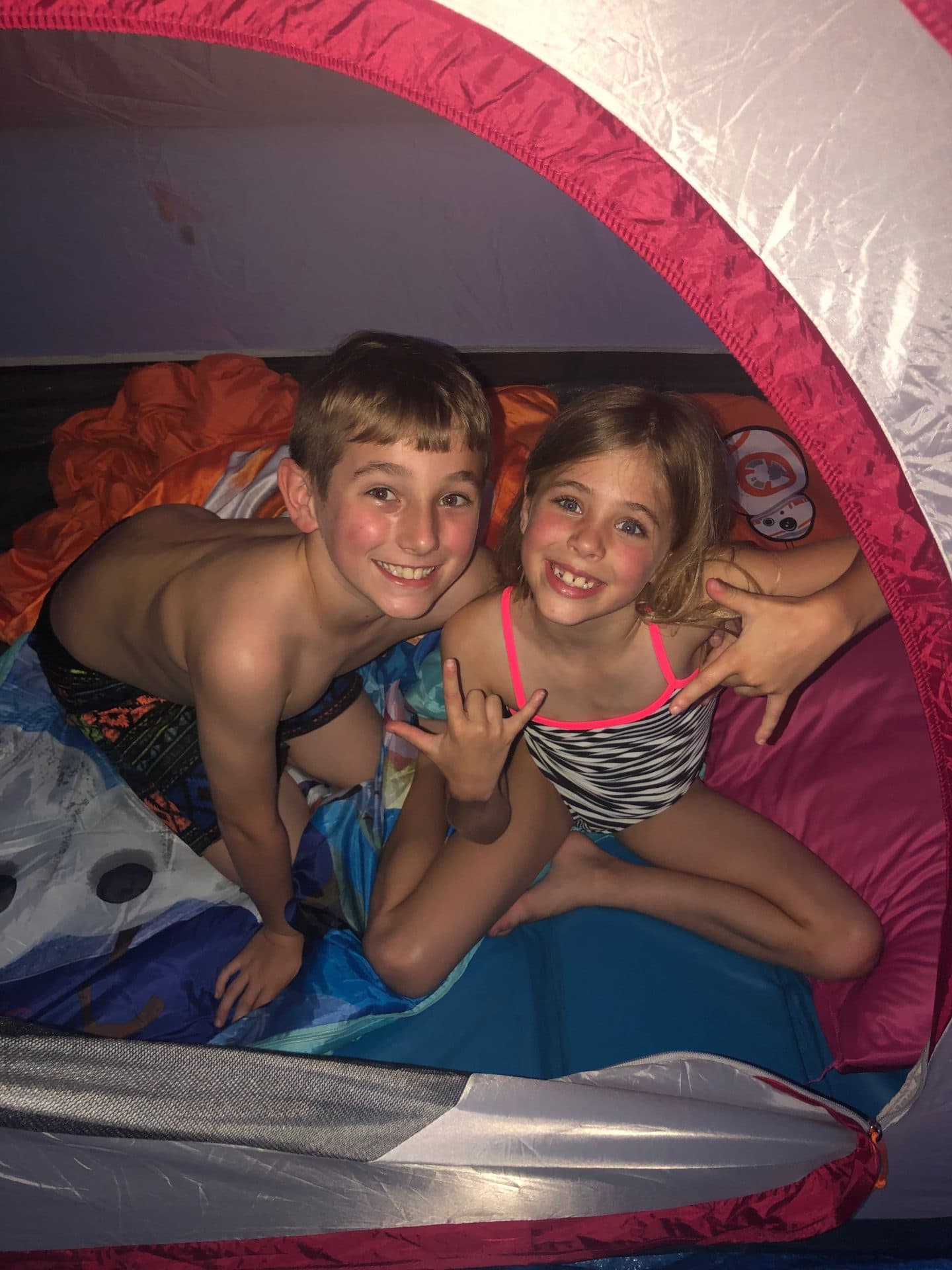 children camping and eating s'mores