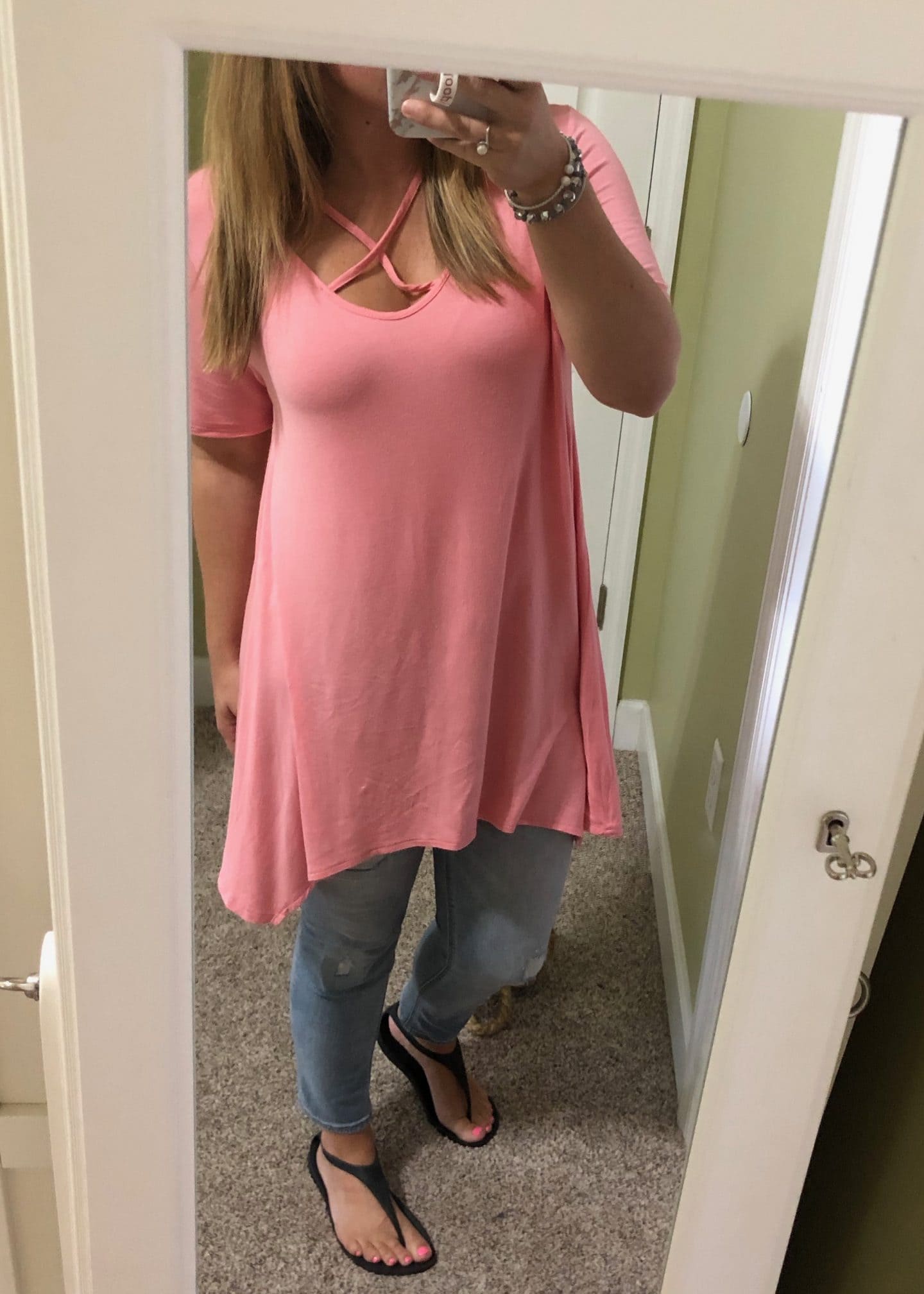 pink tunic and jeans