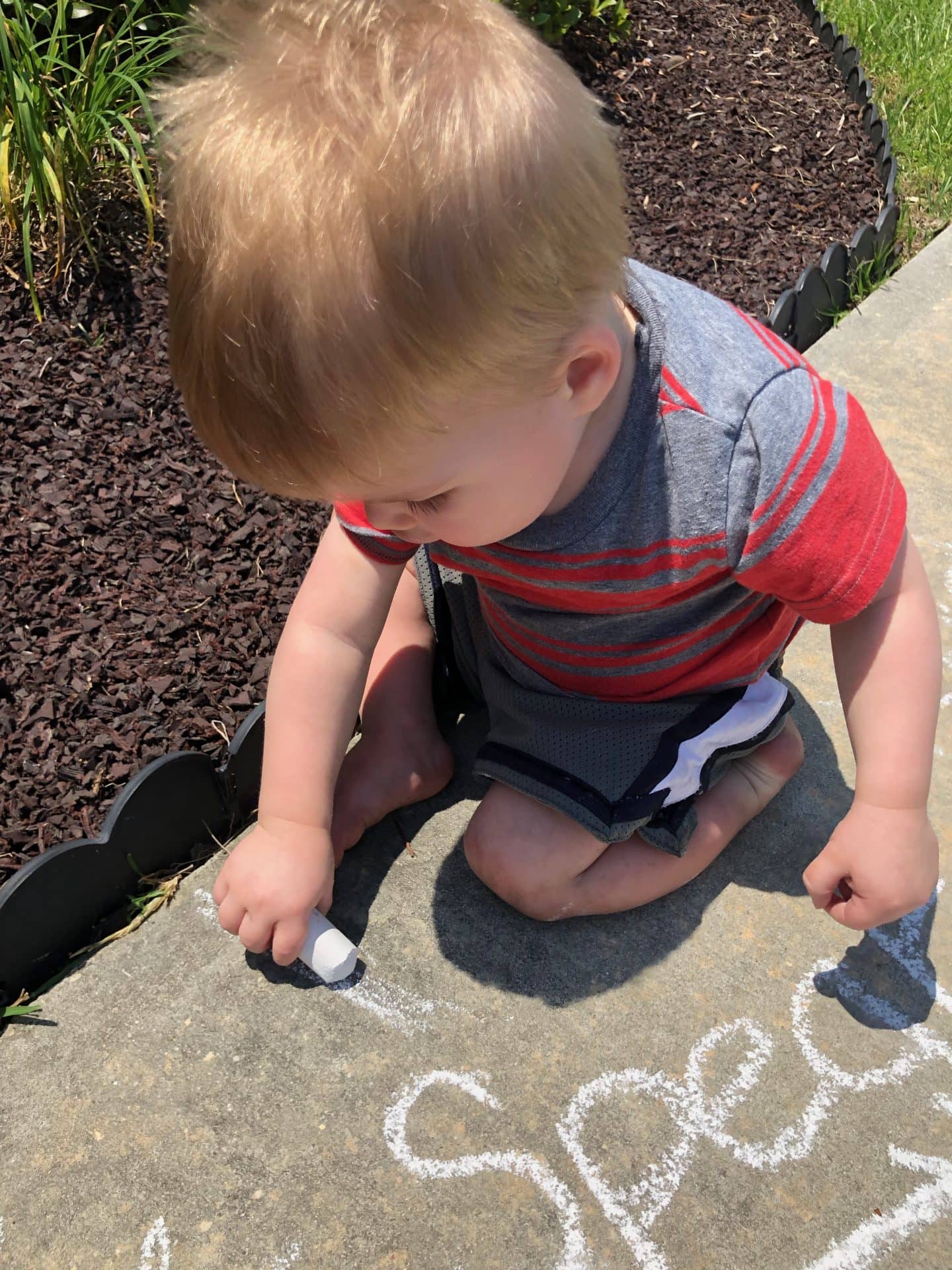 toddler drawing chalk