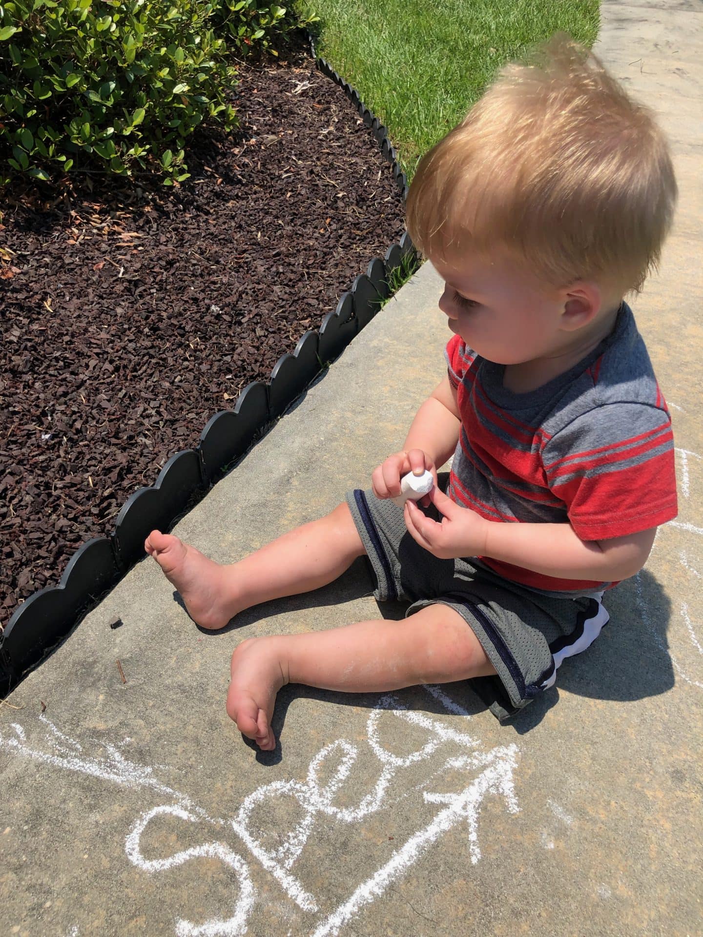 toddler drawing chalk