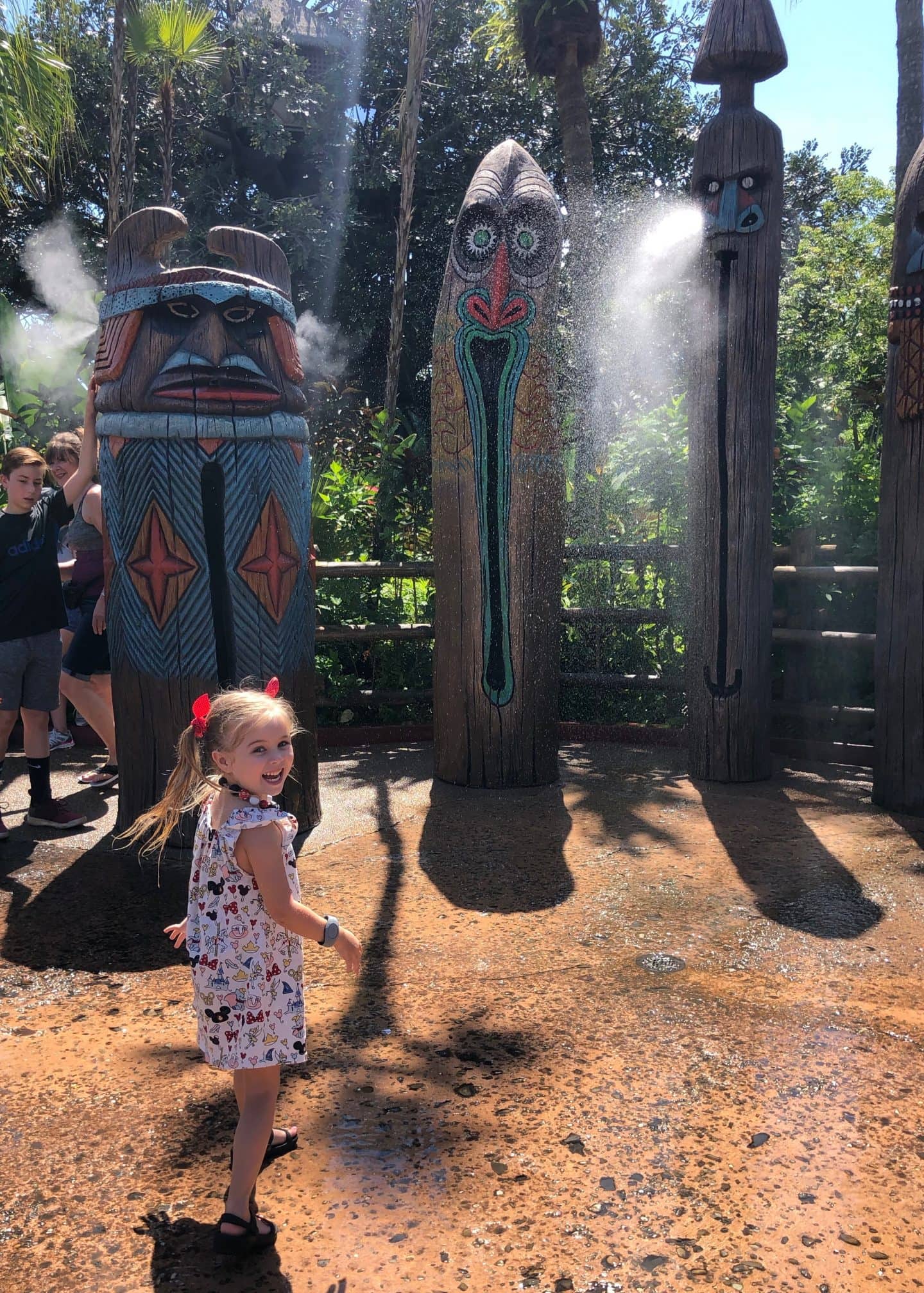 playing in water in Adventureland at magic kingdom