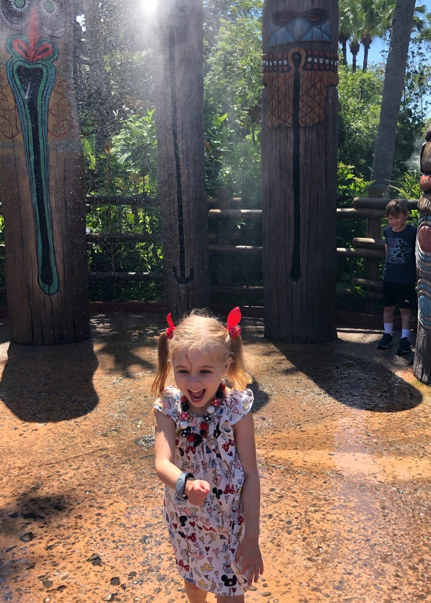 playing in water in Adventureland at magic kingdom