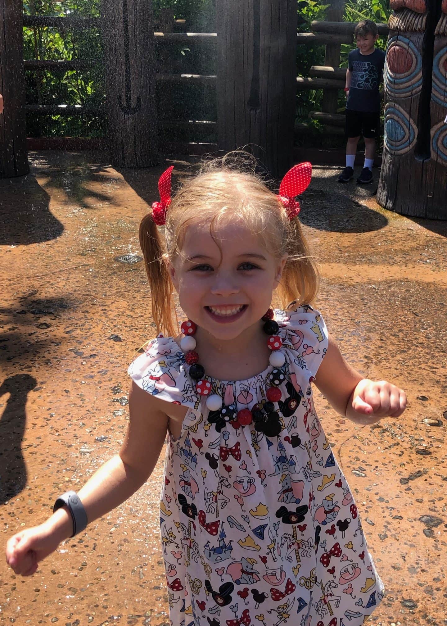 playing in water in Adventureland at magic kingdom