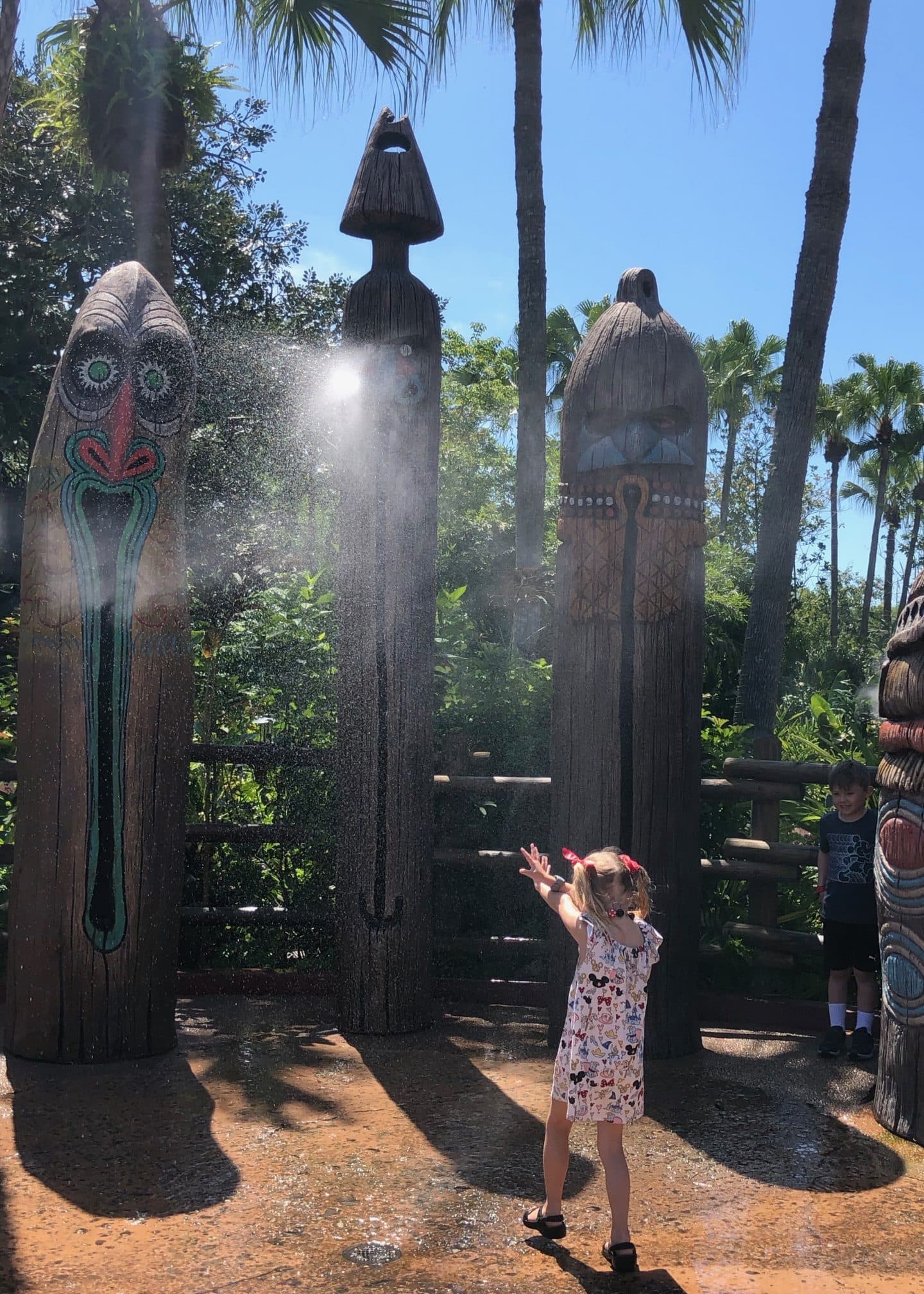 playing in water in Adventureland at magic kingdom