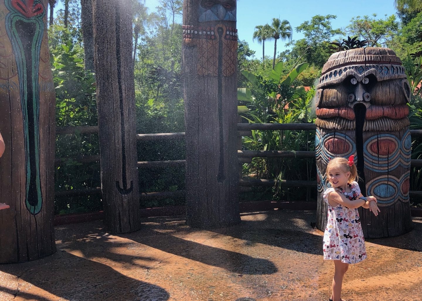 playing in water in Adventureland at magic kingdom