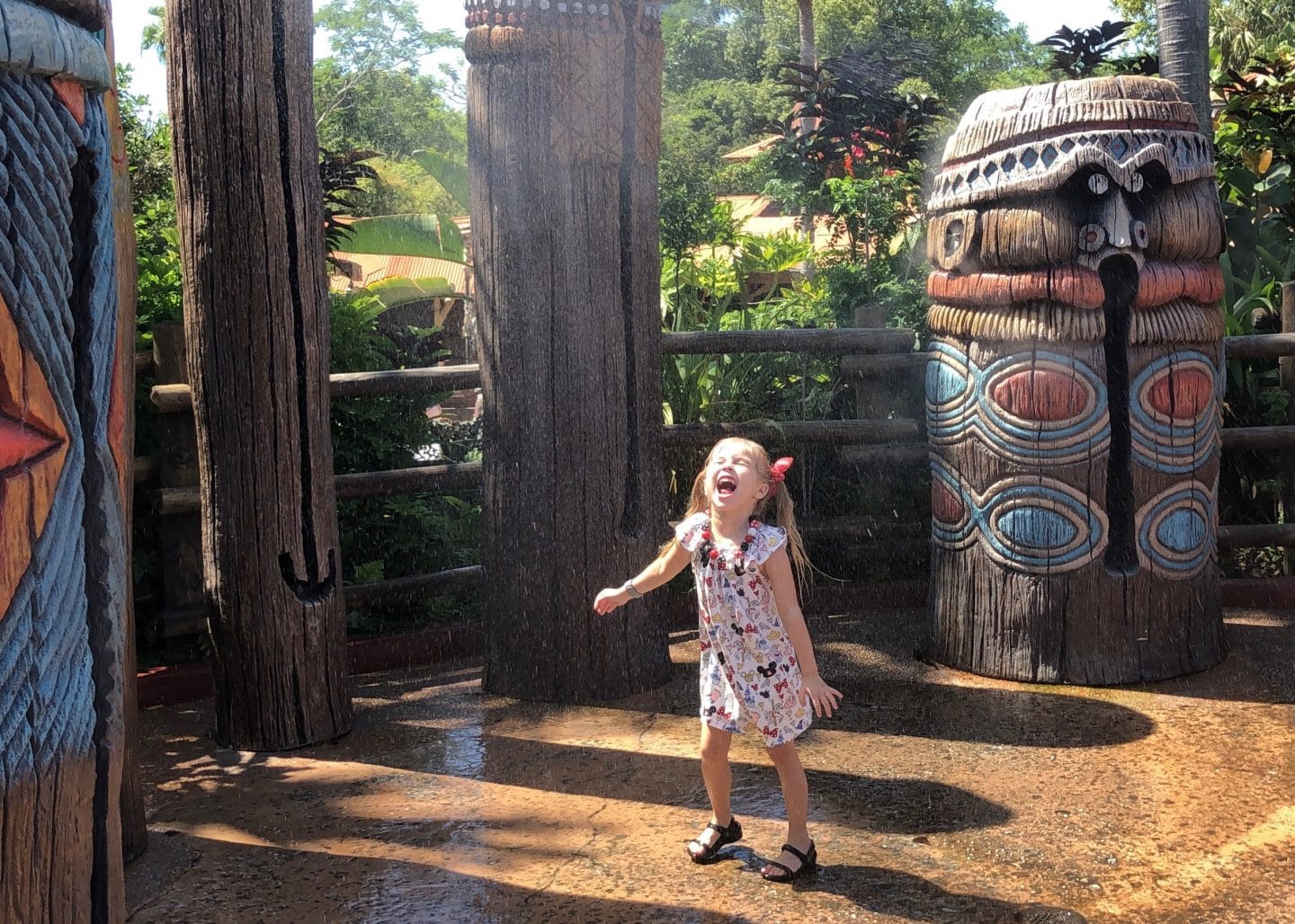 playing in water in Adventureland at magic kingdom