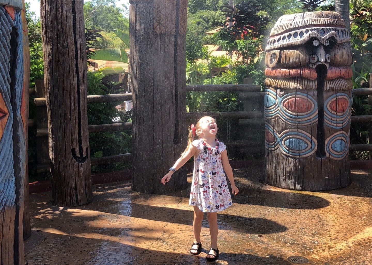 playing in water in Adventureland at magic kingdom