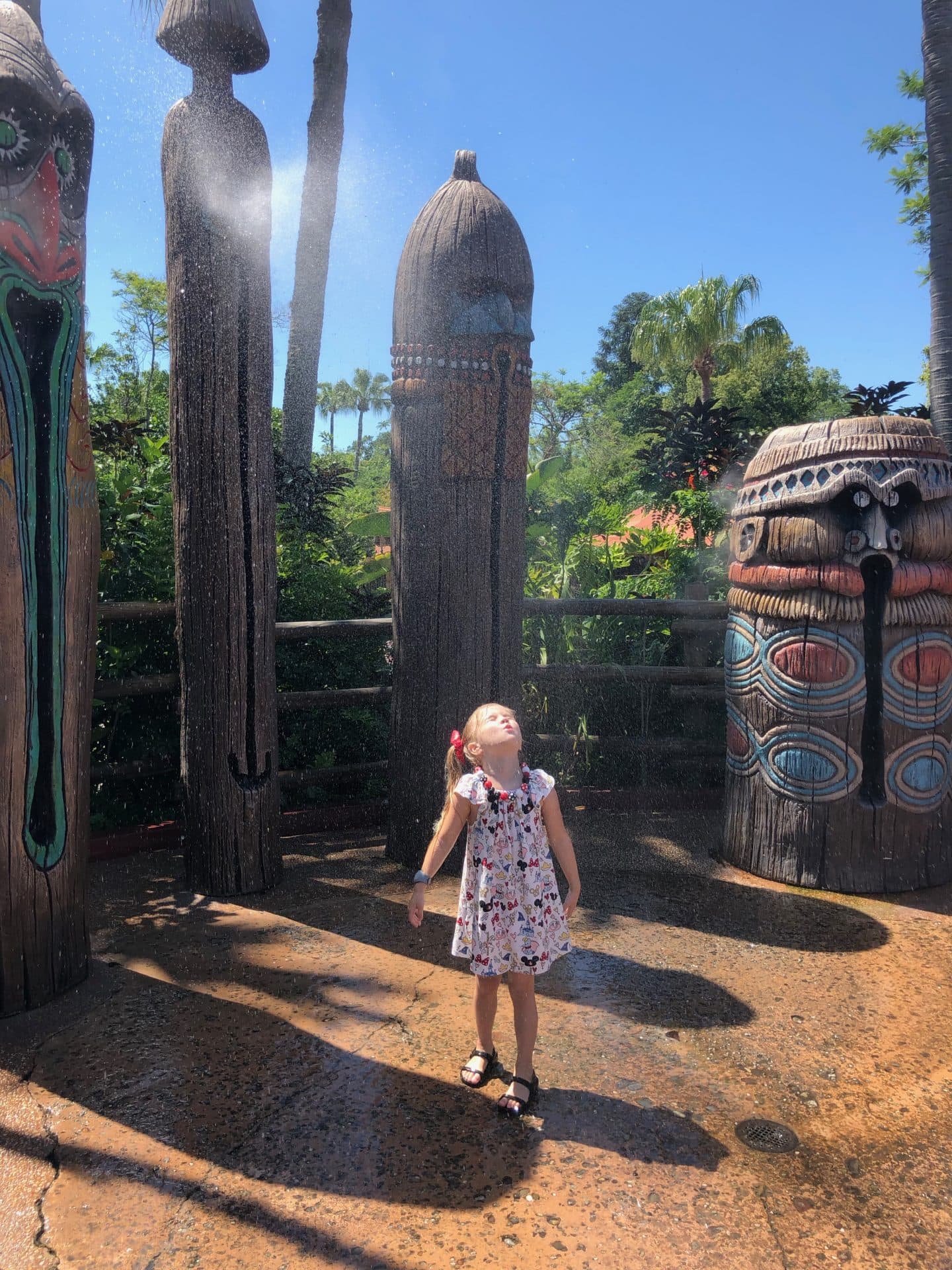 playing in water in Adventureland at magic kingdom