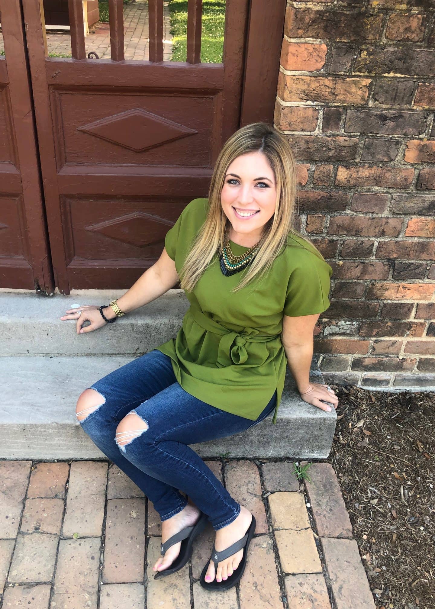 green top and jeans