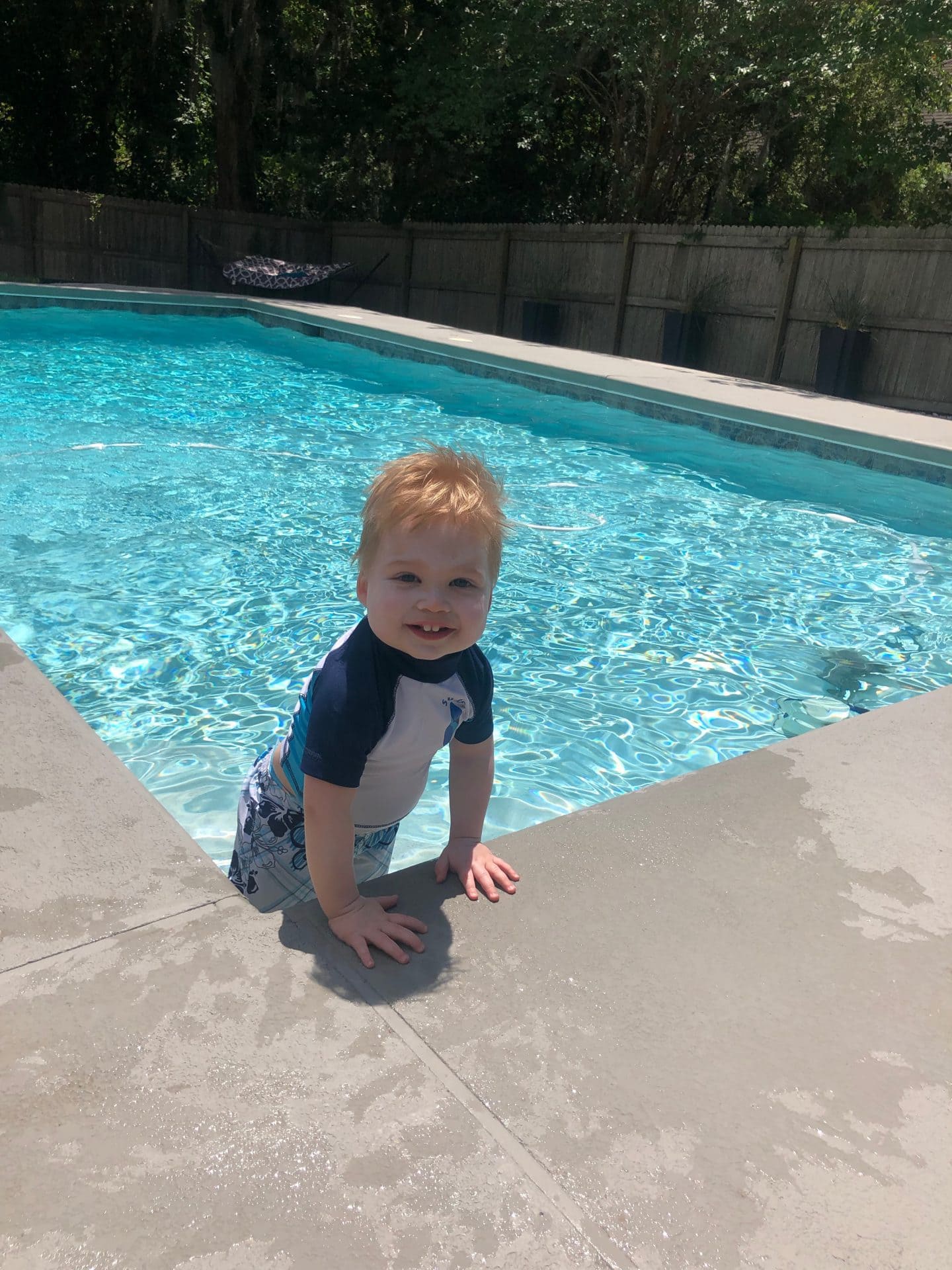 toddler boy in pool