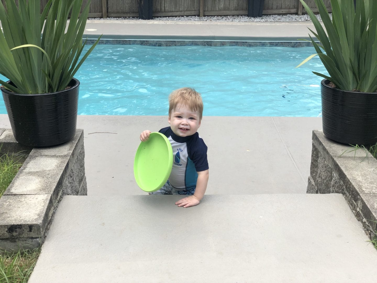 toddler boy in pool