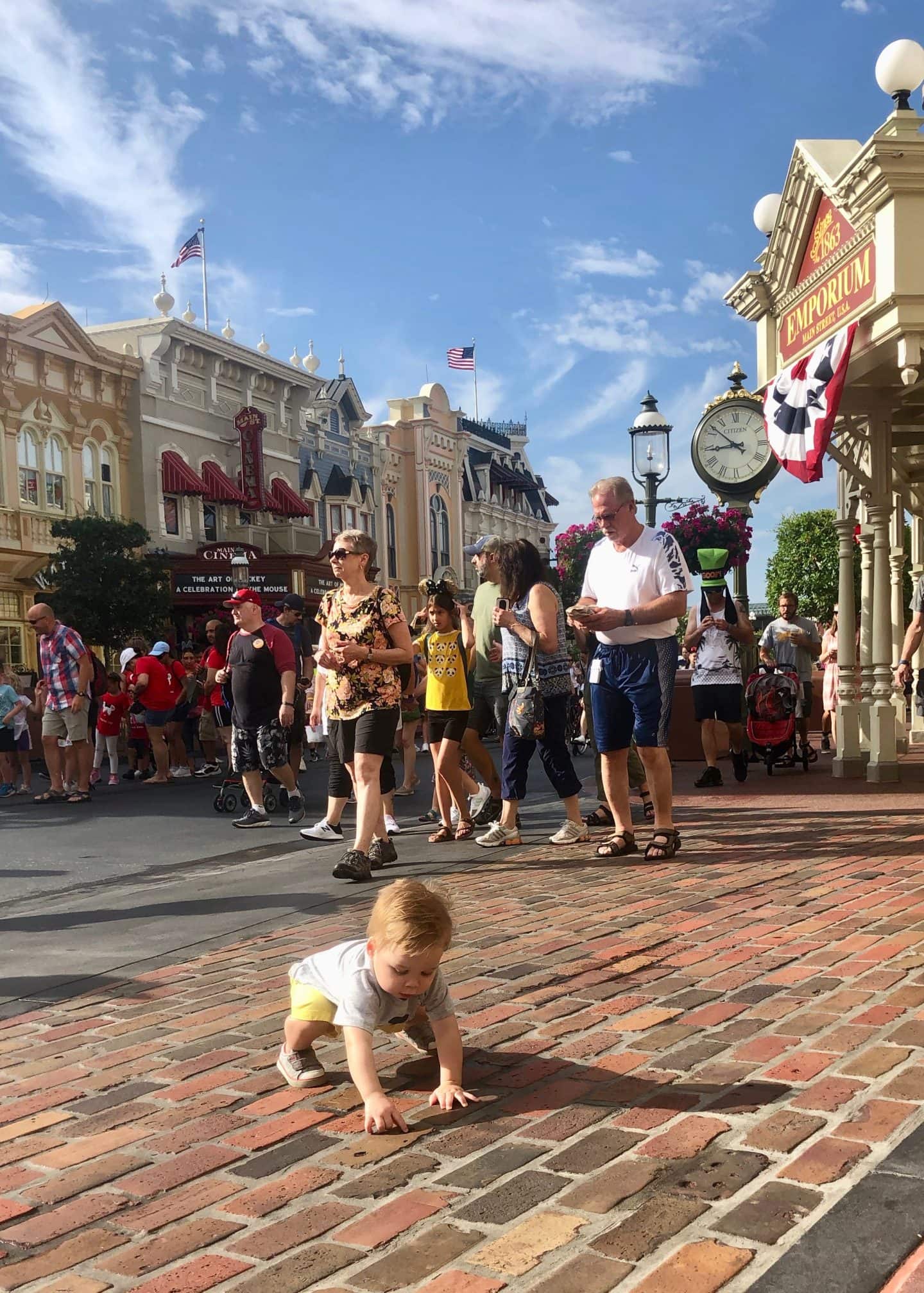 toddler boy walking down Main Street at magic kingdom Disney World