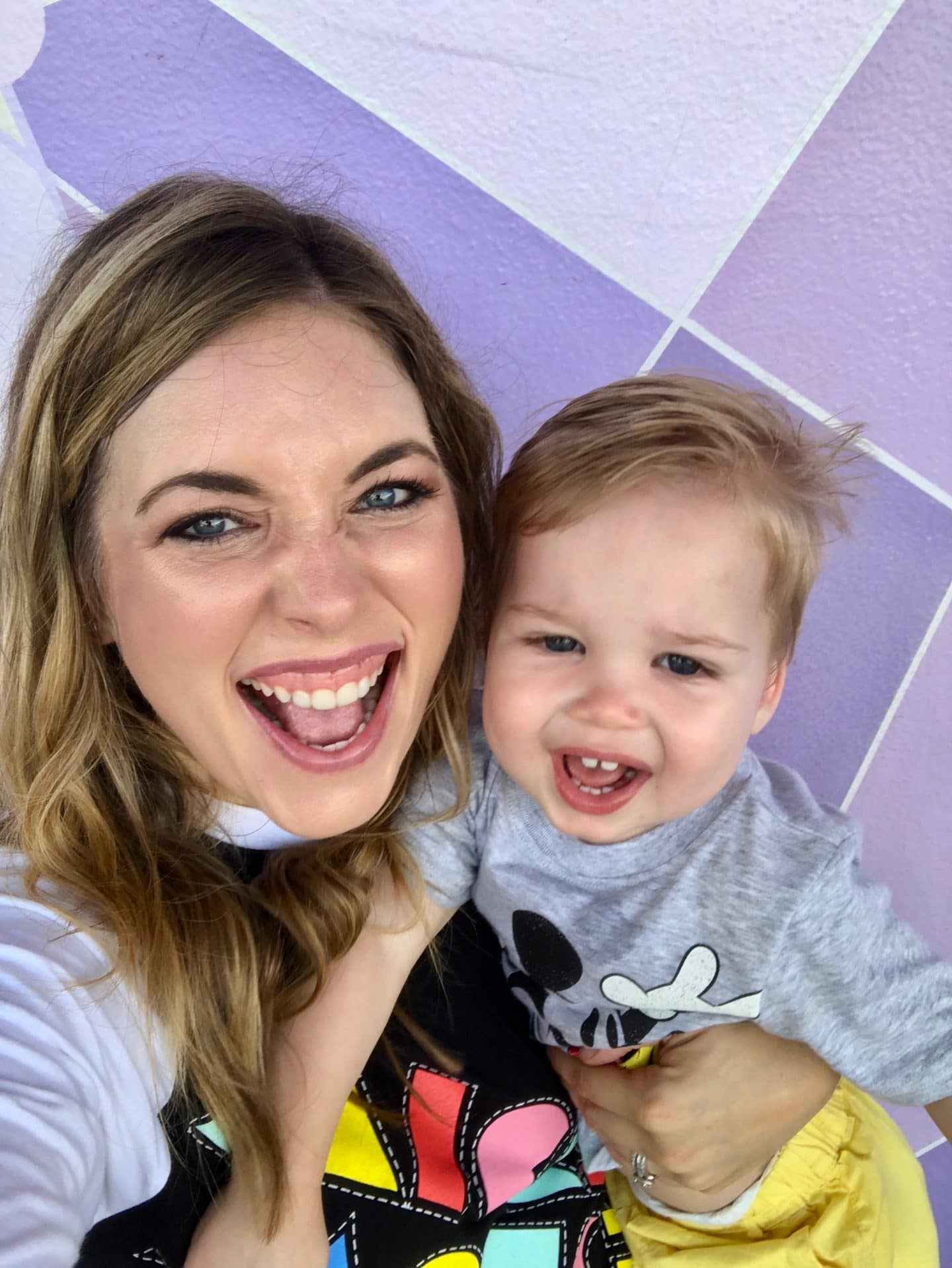 purple wall at magic kingdom with toddler