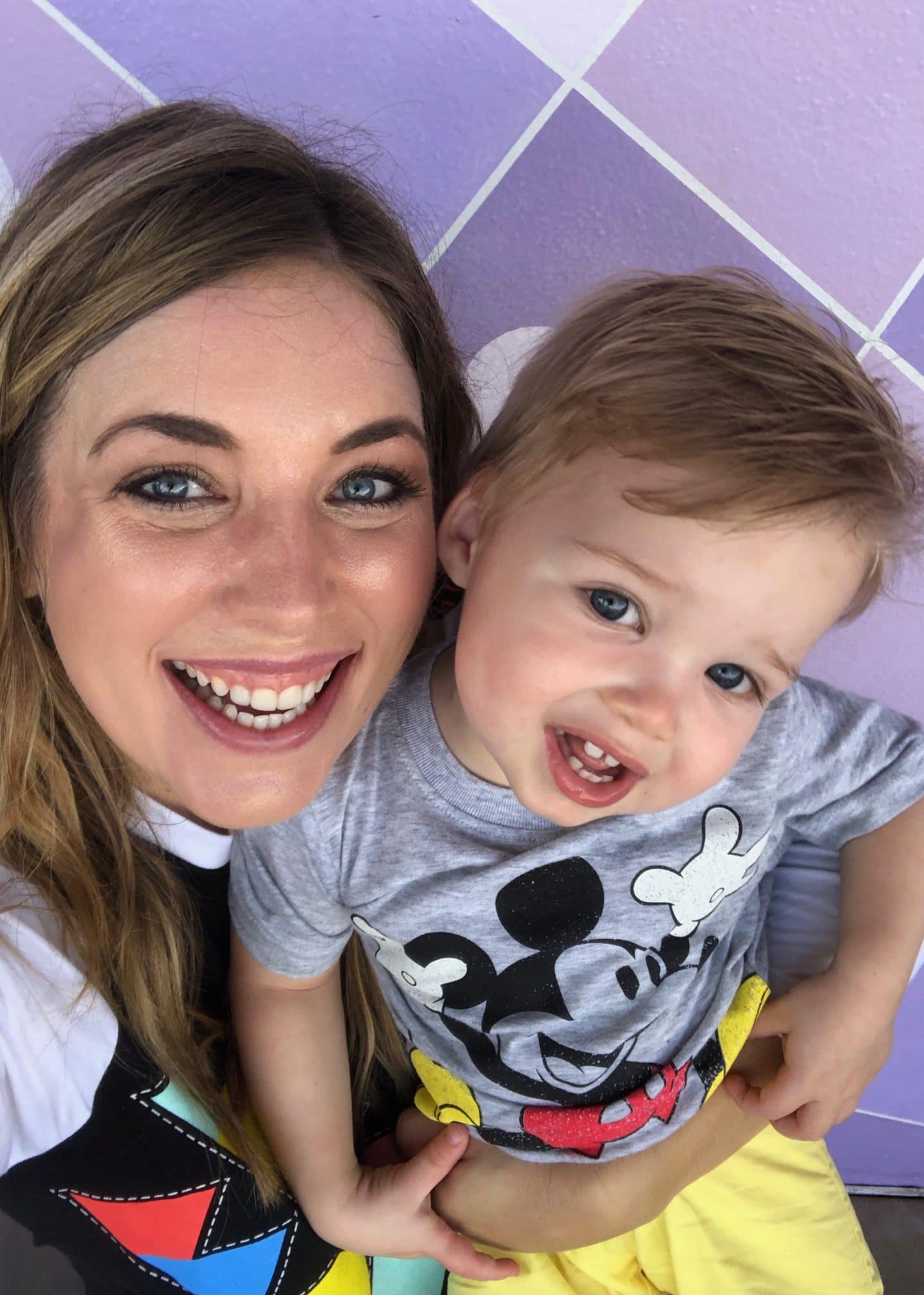 purple wall at magic kingdom with toddler