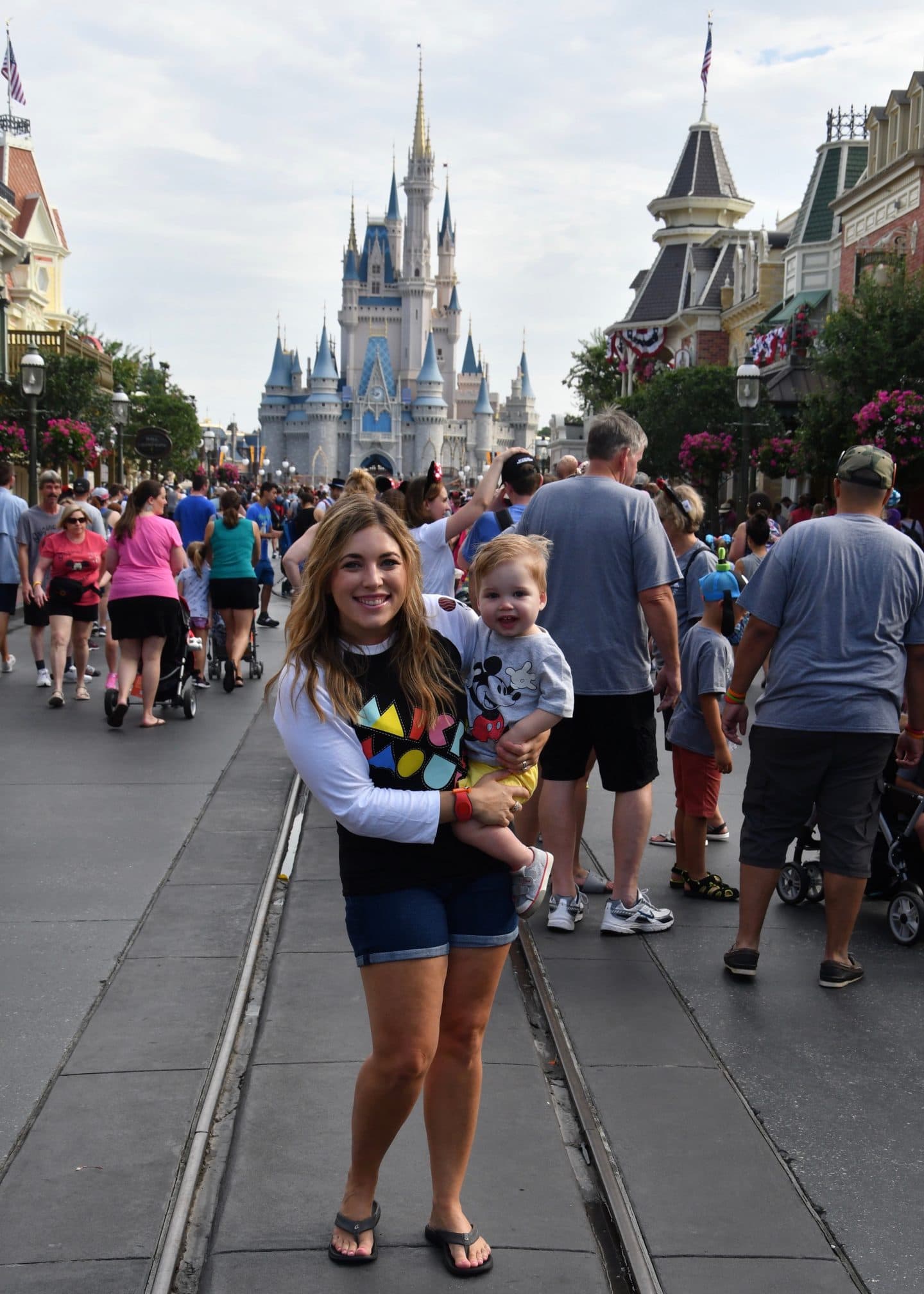 cinderella's castle magic kingdom with a toddler