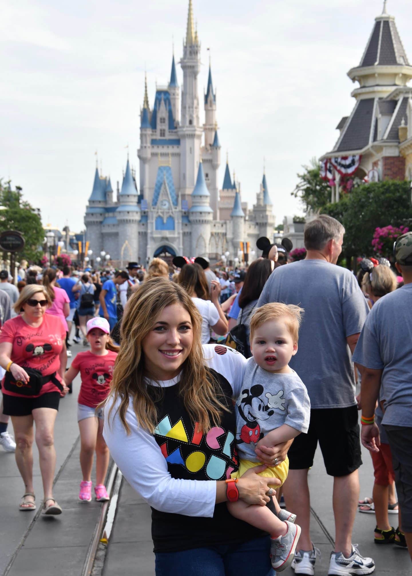 cinderella's castle magic kingdom with a toddler