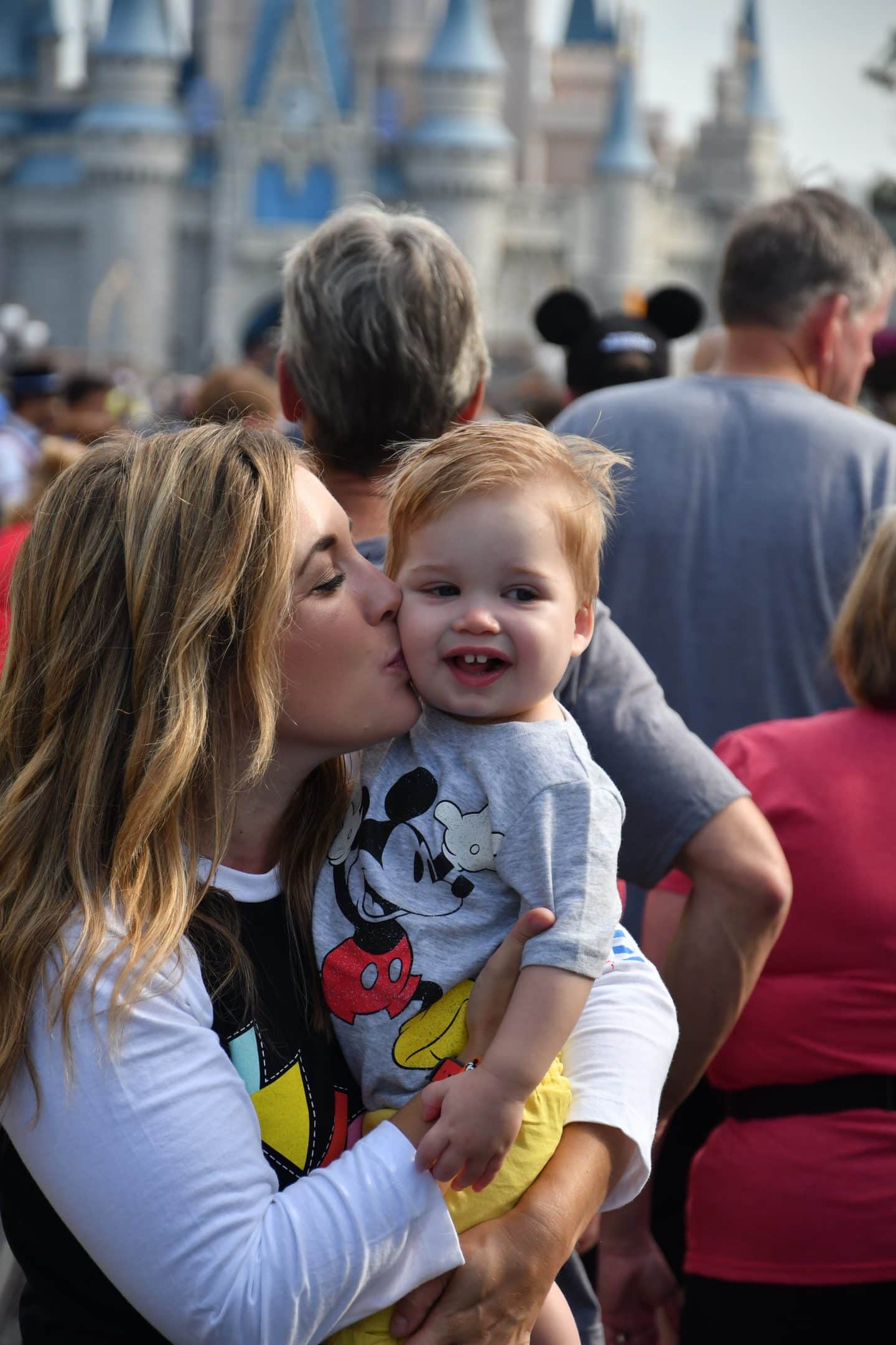 cinderella's castle magic kingdom with a toddler