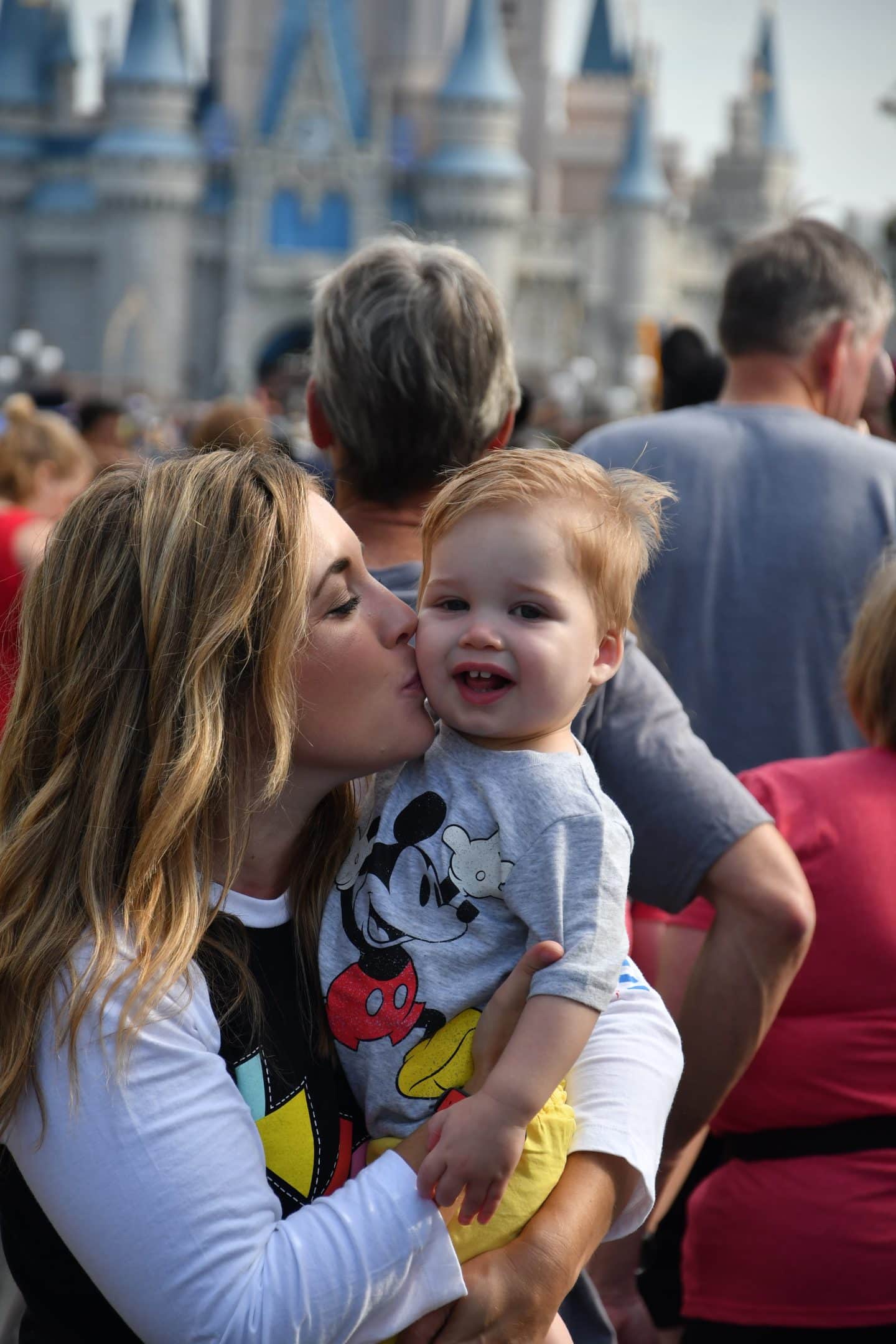 cinderella's castle magic kingdom with a toddler