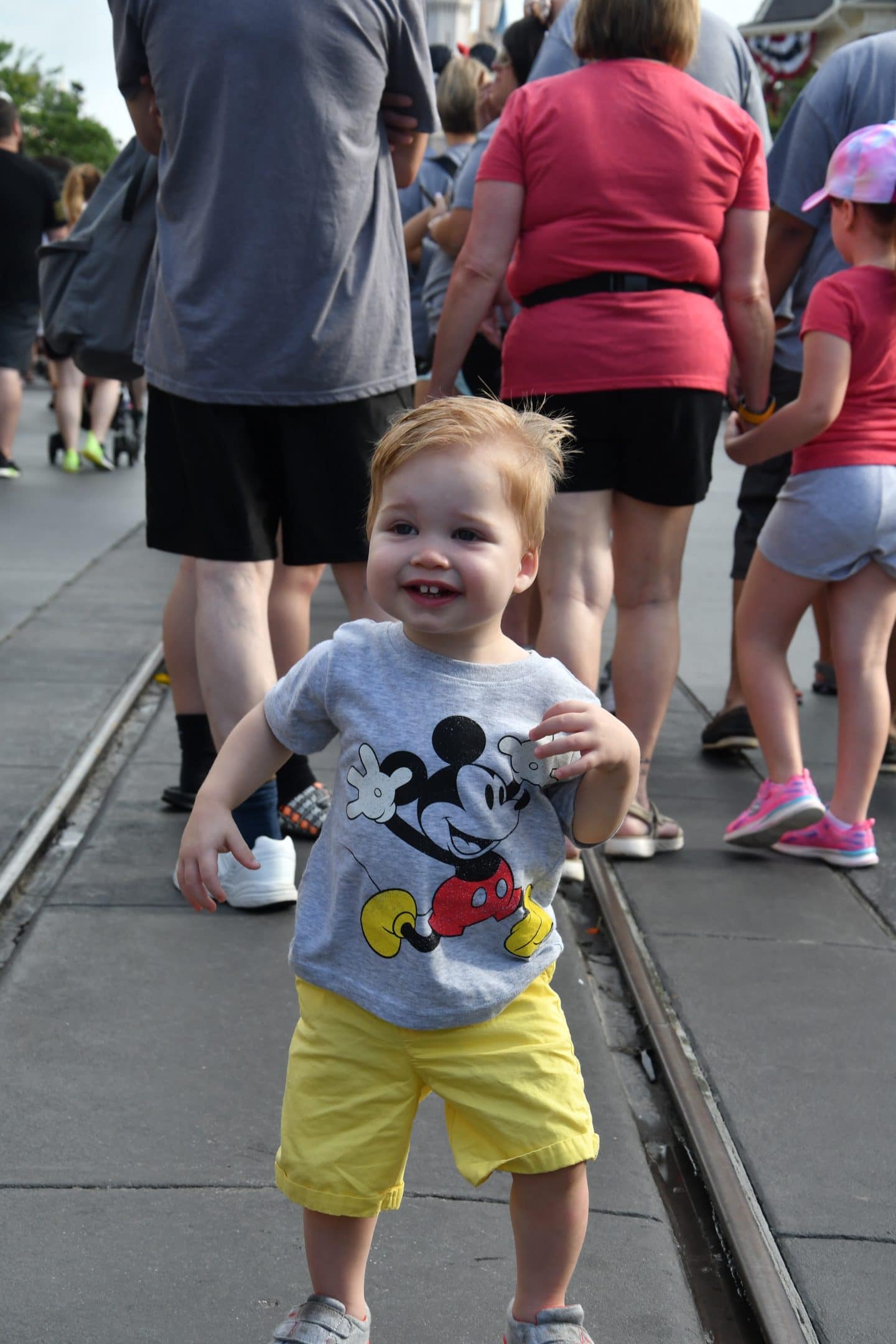 cinderella's castle magic kingdom with a toddler