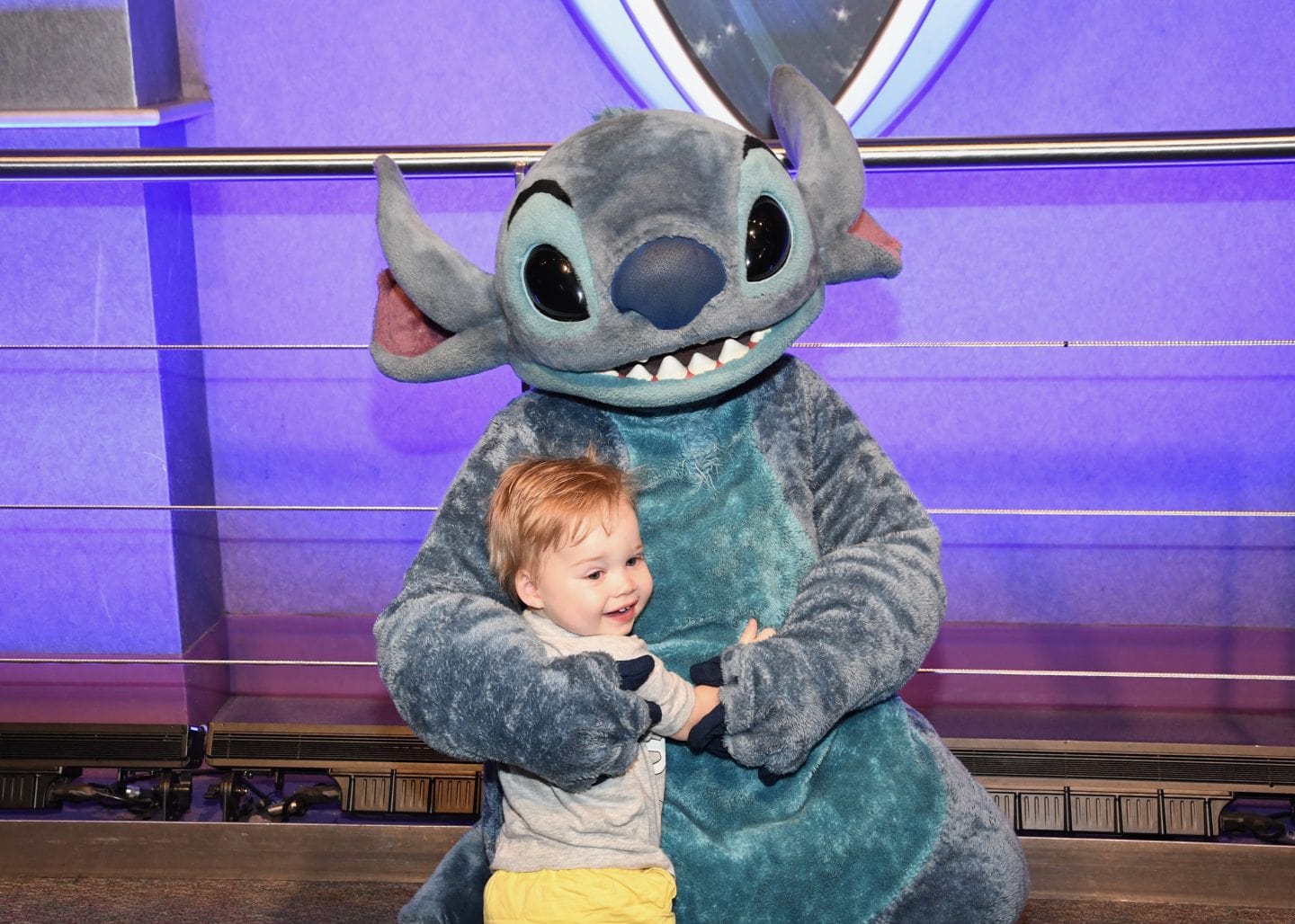 toddler boy meeting stitch at Disney World magic kingdom