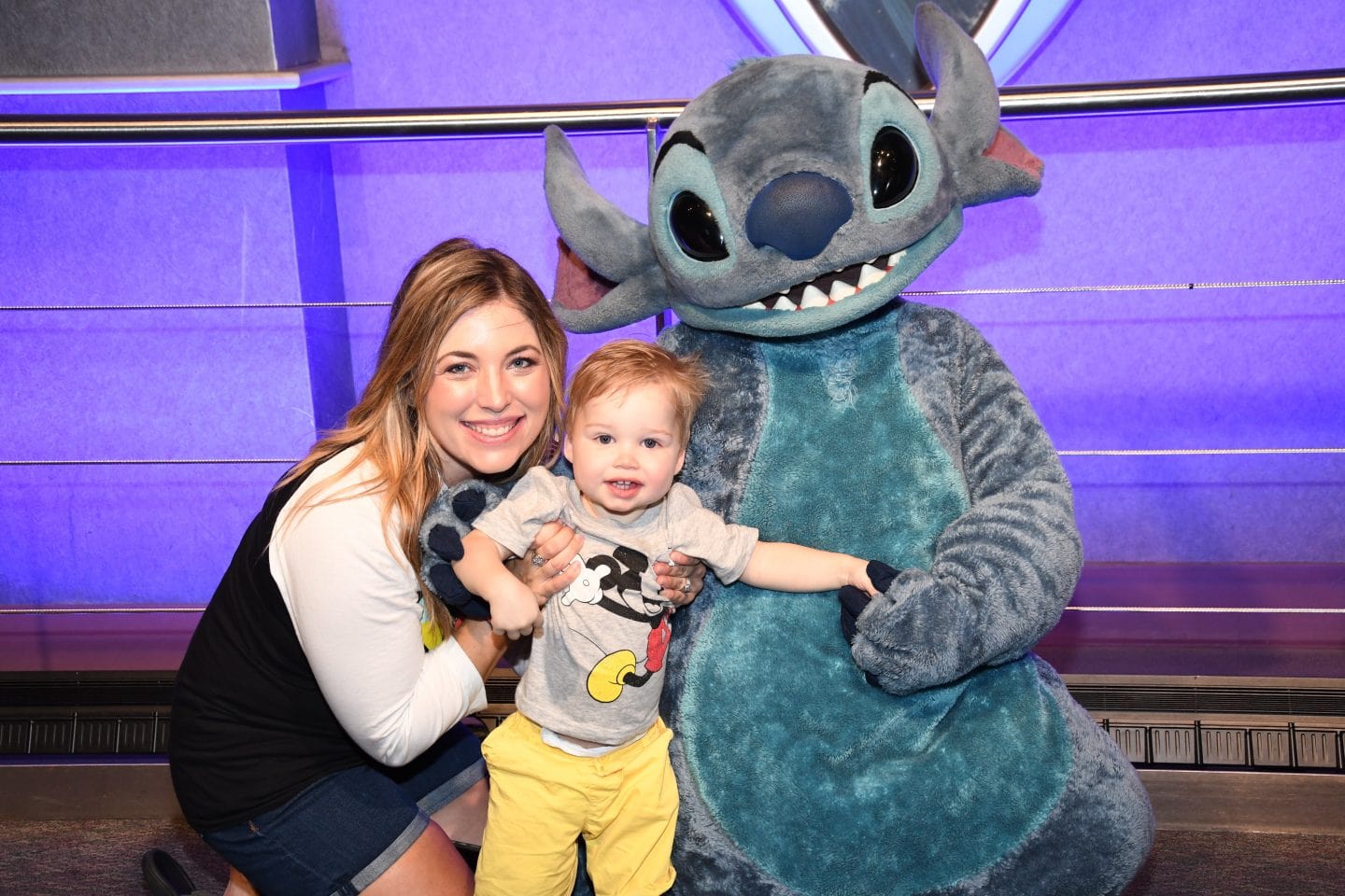 toddler boy meeting stitch at Disney World magic kingdom