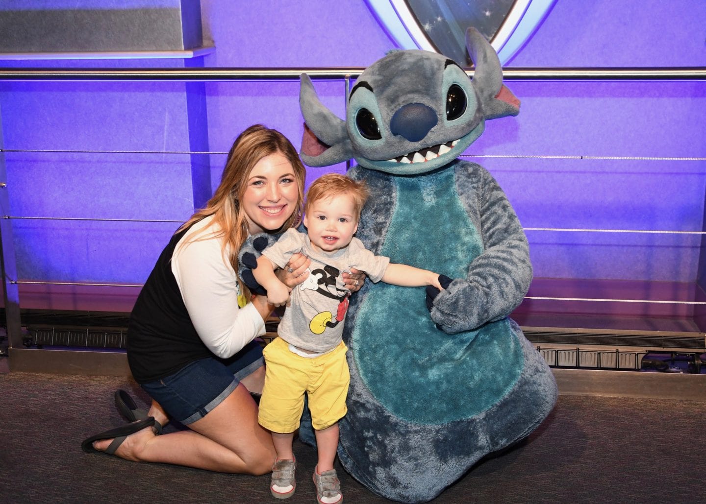 toddler boy meeting stitch at Disney World magic kingdom
