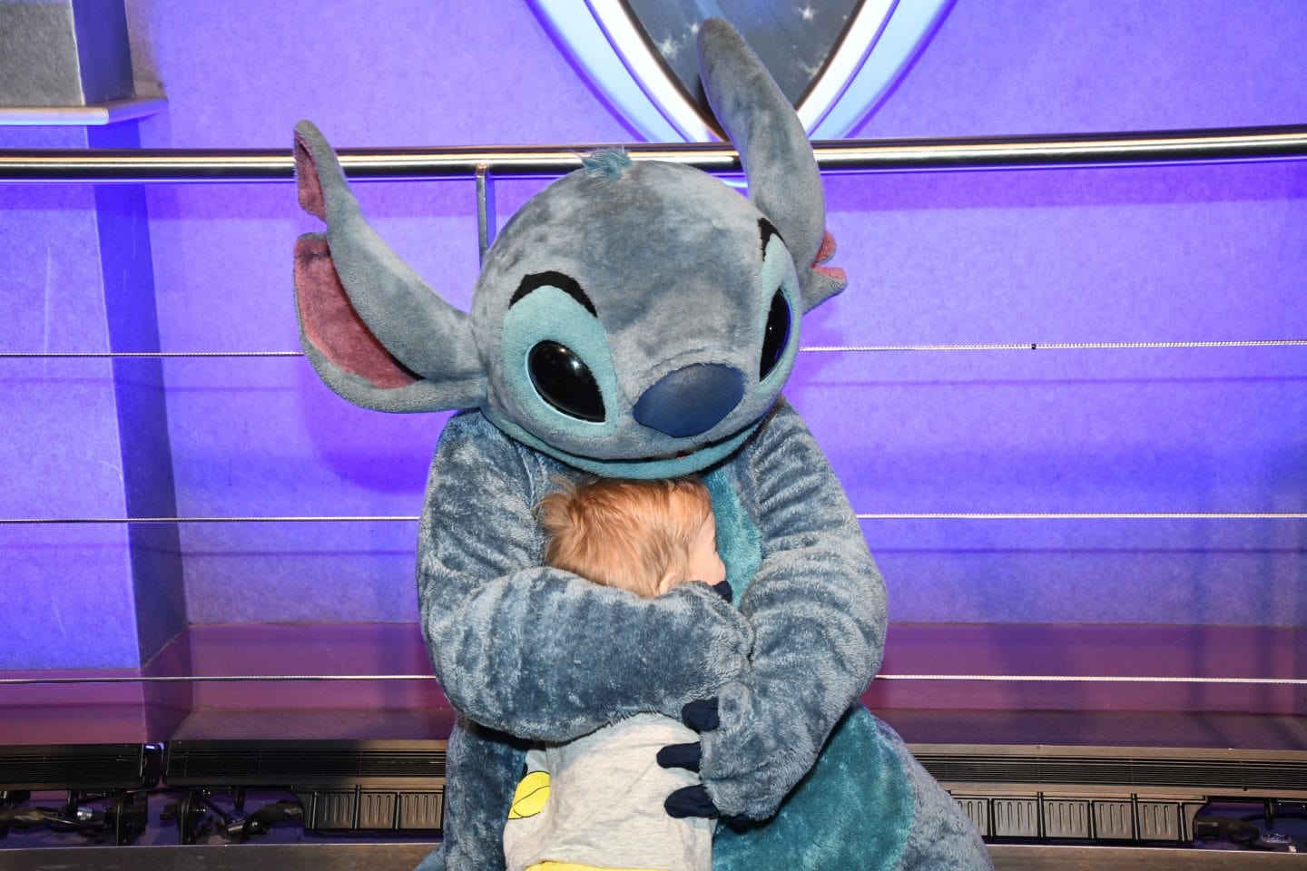 toddler boy meeting stitch at Disney World magic kingdom