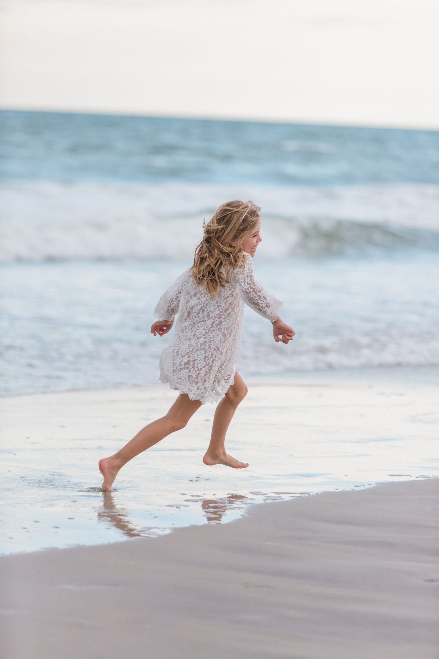 girl on beach by captured by Colson