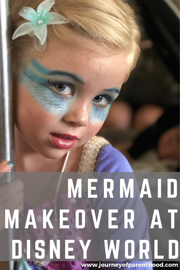 little girl at disney world with mermaid makeover from the pirate's league