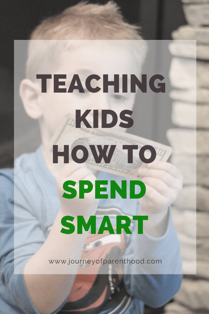 boy with money - teaching kids how to spend smart