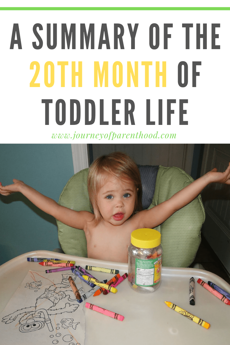 toddler girl in high chair coloring