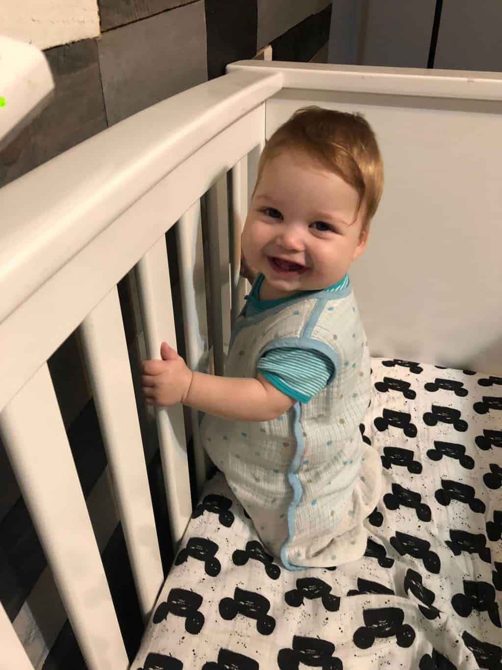 how To Drop the 3rd Nap With Babywise - baby standing in crib