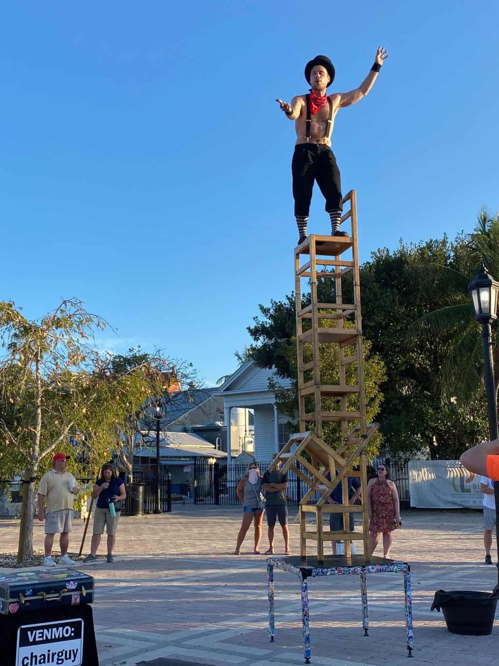 street performer in mallory square during sunset celebration