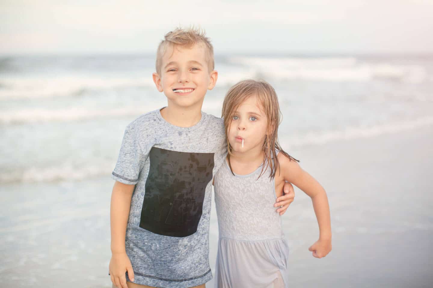 siblings at the beach during a family beach photography session