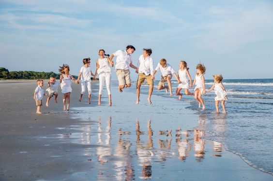 jumping beach family picture