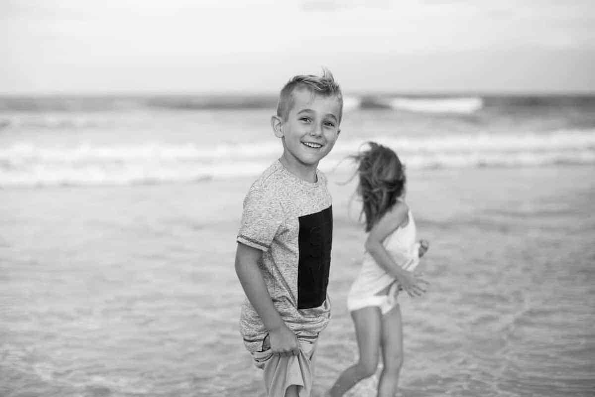 boy playing on beach professional beach family photo