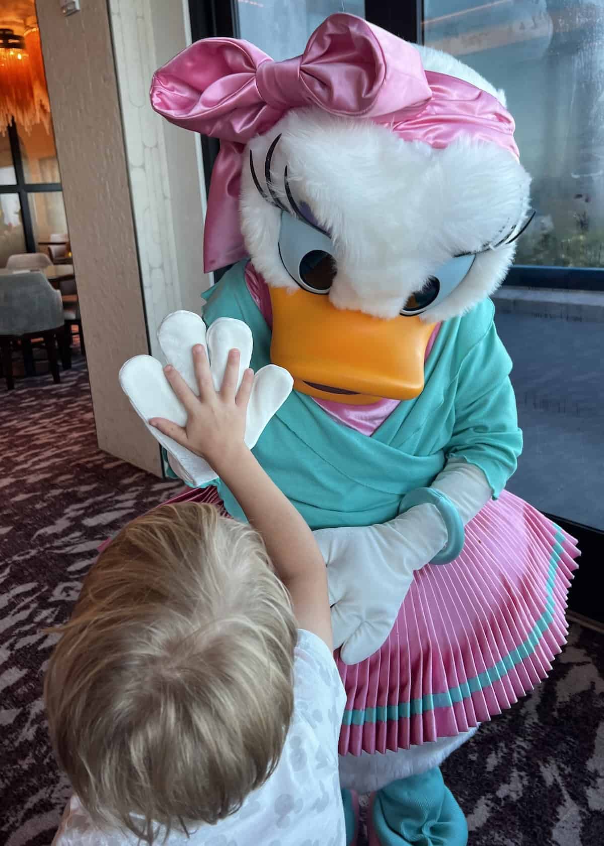 A family review of Topolino's Character Breakfast at Disney World and how to get a reservation at Topolino's Terrace Character Breakfast!