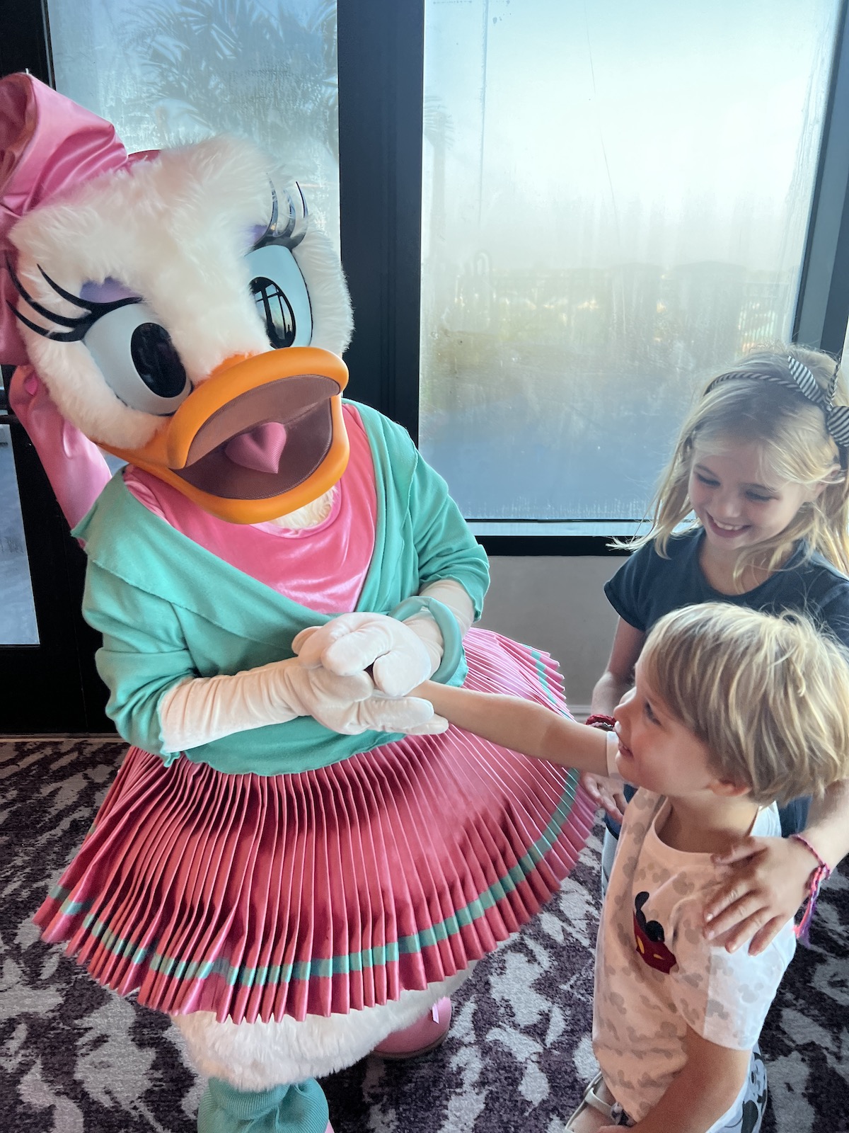 A family review of Topolino's Character Breakfast at Disney World and how to get a reservation at Topolino's Terrace Character Breakfast!